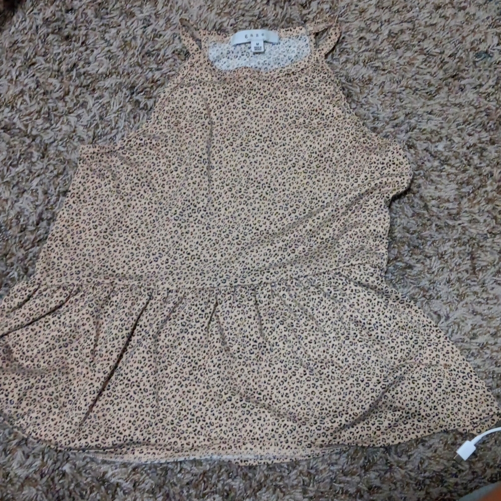 A cute tank top with a tutu looking bottom!